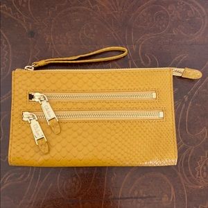 Cole Haan small gold/yellow wristlet
